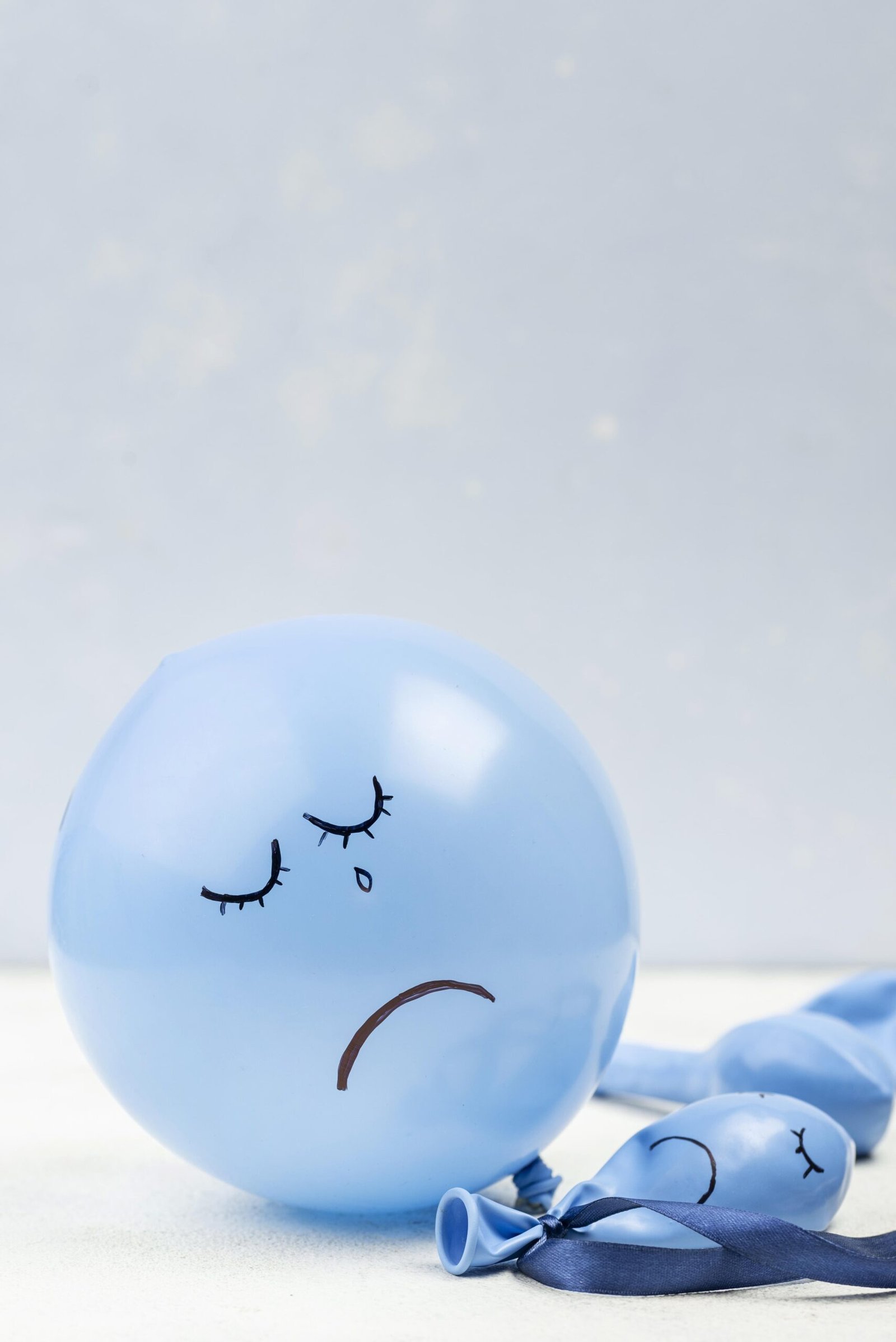 front-view-sad-balloon-blue-monday (1)