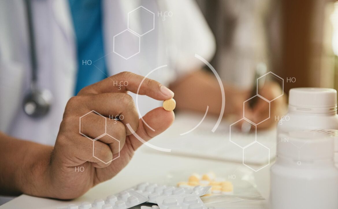 pharmacist-writes-clipboard-holds-pills-pharmacy (1)